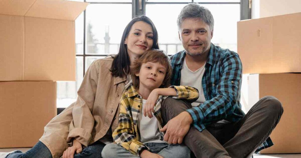 Mom, Dad and child with moving boxes