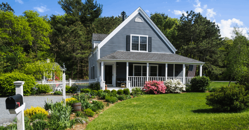 A well-maintained home with strong curb appeal, featuring a freshly painted exterior, neatly trimmed lawn, and colorful flower beds."