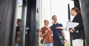 Couple talking to real estate agent